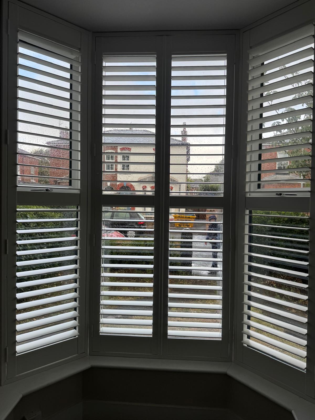 Bay window fitted with plantation shutters